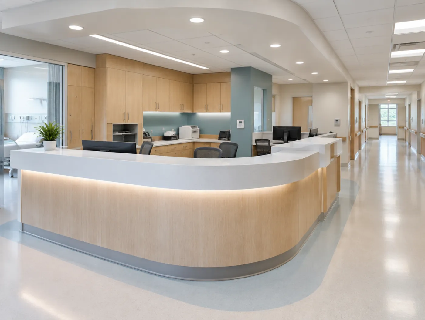 A hospital nurse station with a curved solid surface counter